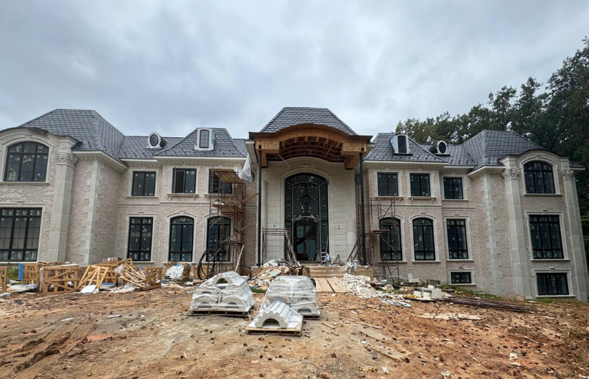 Exterior view of a new build project by a custom home interior designer in Great Falls, VA, specializing in luxury home remodel services.